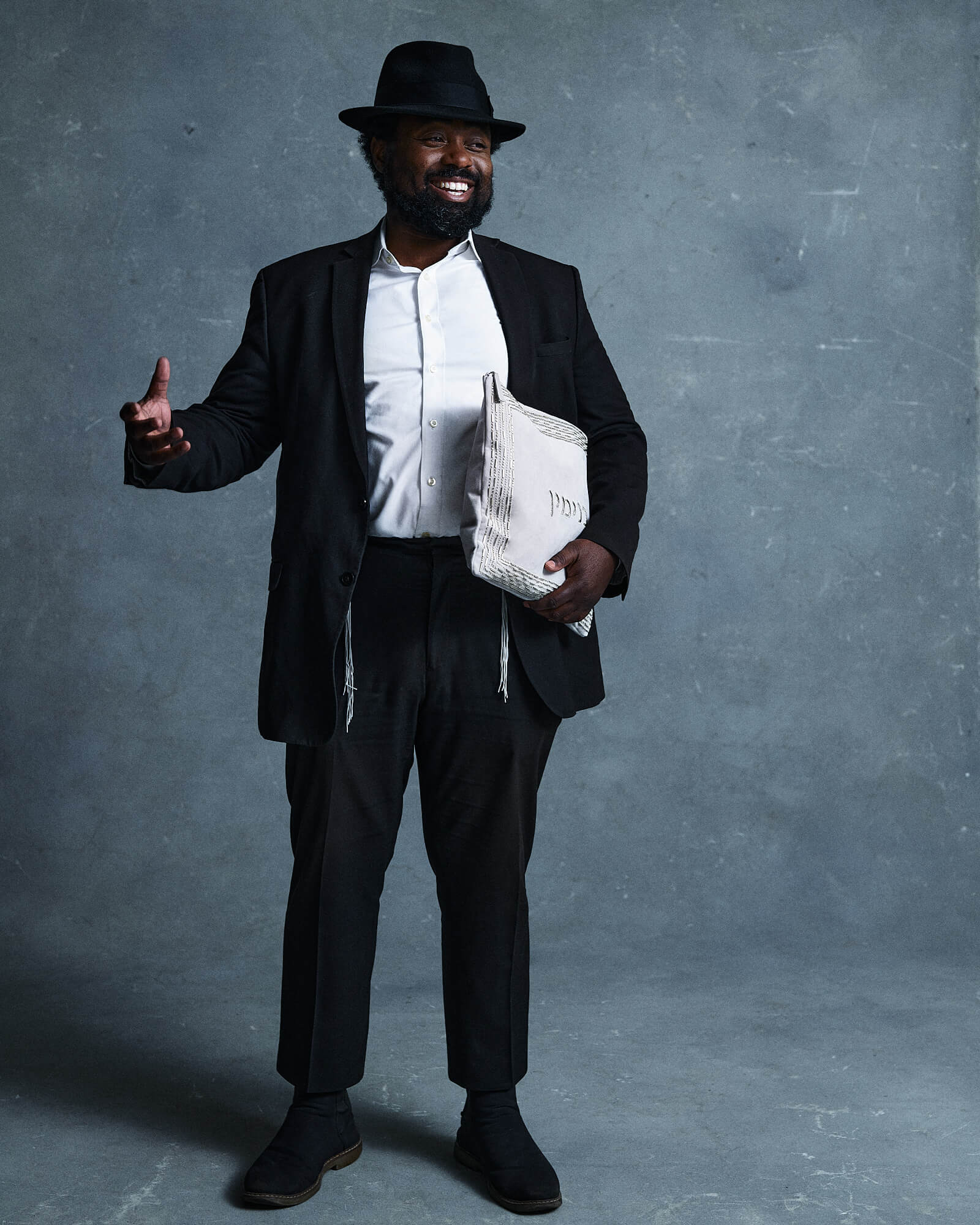 Man holding heirloom tallit bag